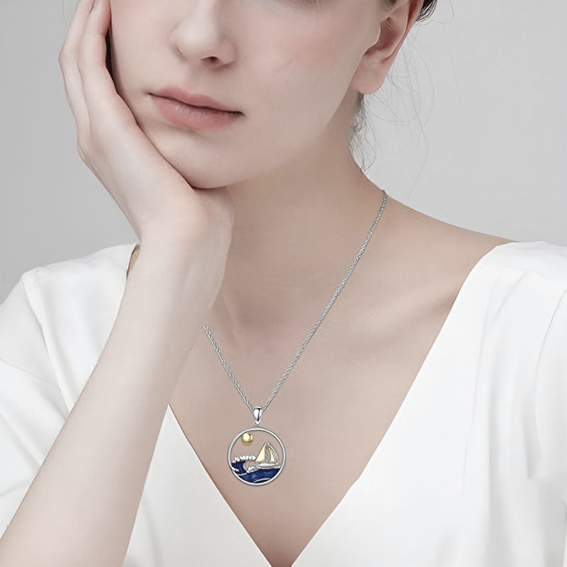 Origsoul sterling silver nautical necklace featuring a sailboat and sun design for a beach-inspired look