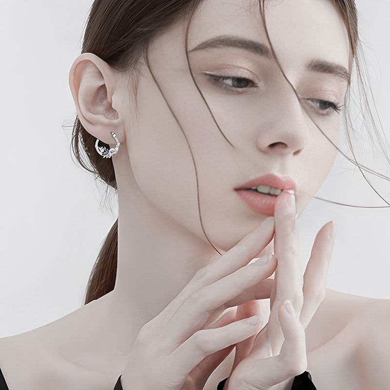 Model wearing sterling silver ocean turtle earrings that reflect elegance and oceanic beauty