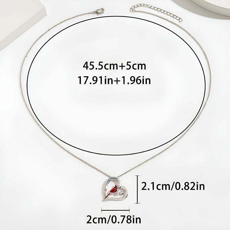 Origsoul sterling silver parrot necklace featuring a heart design with a red accent stone