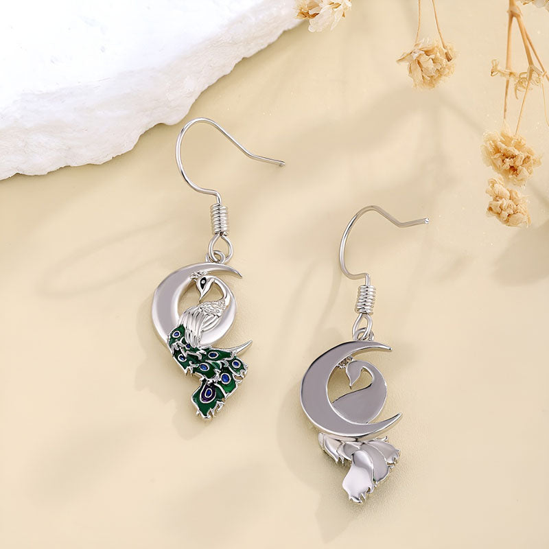 Unique sterling silver peacock earrings with intricate design and colorful detailing for elegant style