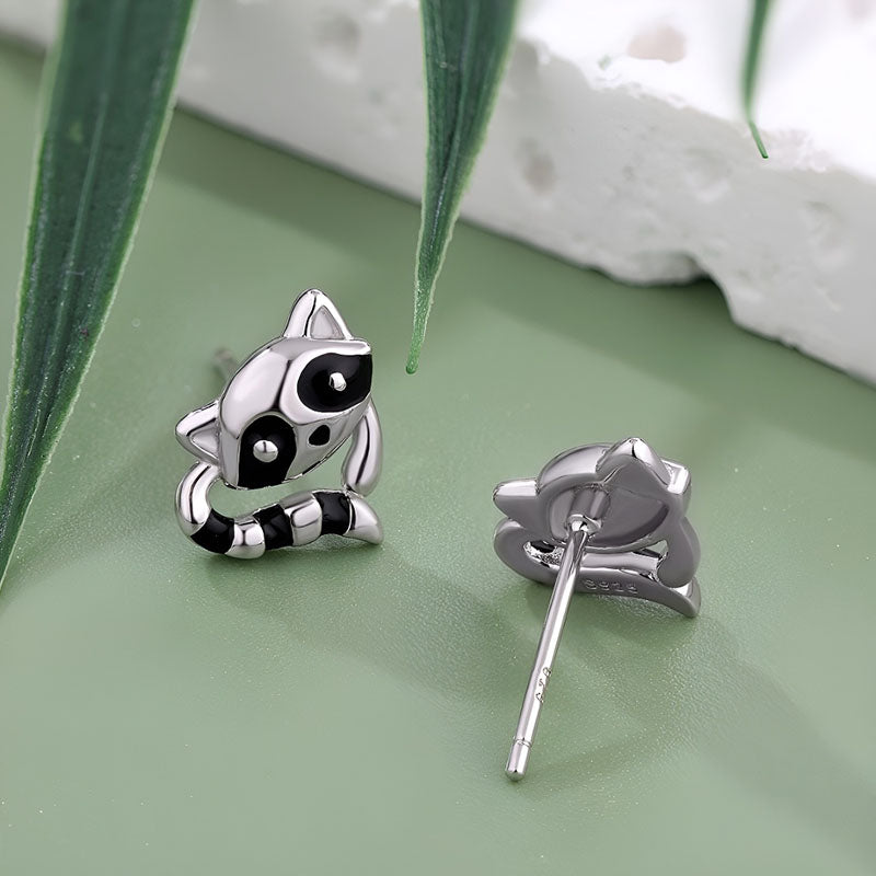 Cute sterling silver raccoon earrings featuring detailed playful designs for animal lovers