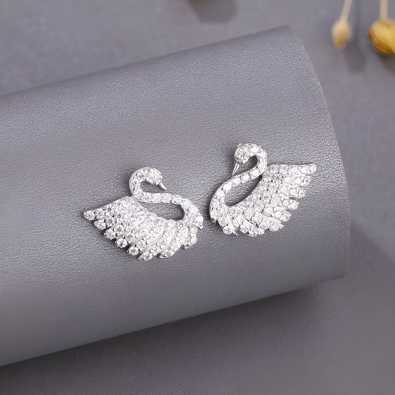 Origsoul sterling silver swan earrings with sparkling accents for elegant style