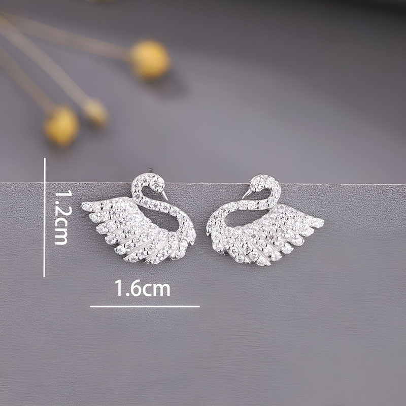 Origsoul sterling silver swan earrings featuring sparkling crystal details for elegant style