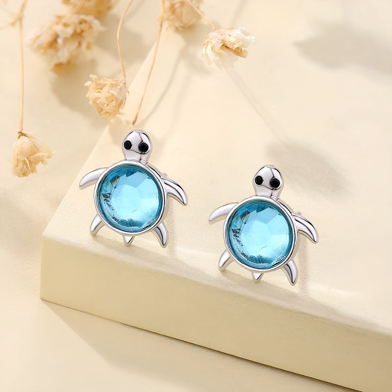 Origsoul sterling silver turtle earrings with blue gemstone accents for a unique ocean-inspired look