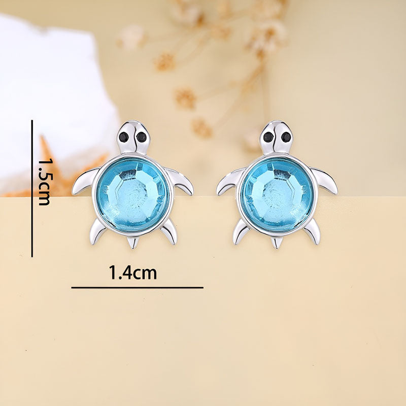 Origsoul sterling silver turtle earrings with sparkling blue gemstones for a stylish ocean-themed look