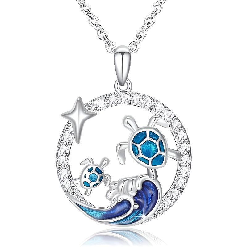 Origsoul sterling silver turtle necklace featuring blue turtles and wave design with sparkling accents