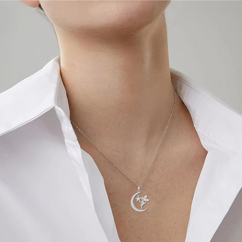 Origsoul fairy moon pendant necklace worn on neck with crescent moon and fairy charm in silver