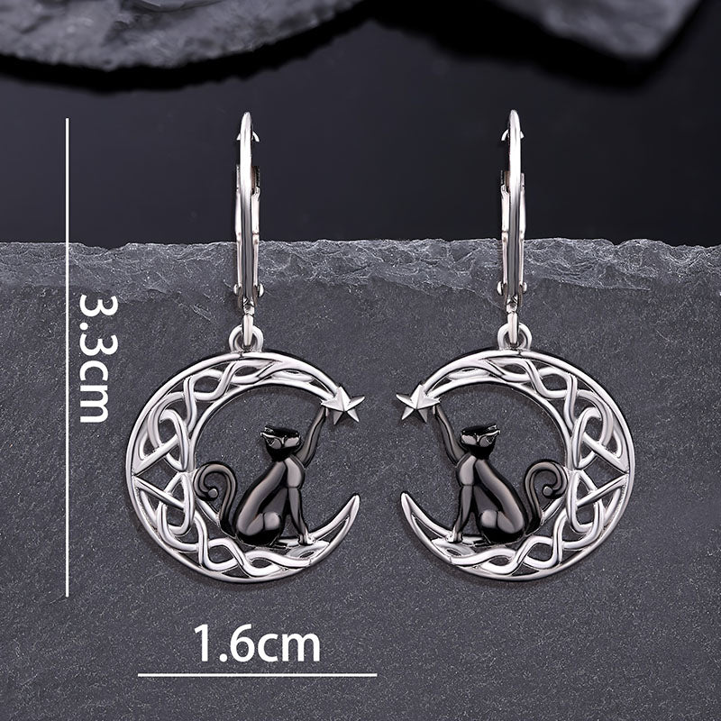 Origsoul cat and moon Celtic earrings with black cat sitting on a Celtic knot crescent moon