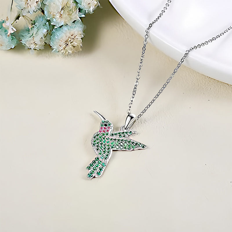 Origsoul green hummingbird pendant necklace with silver chain and intricate gemstone detailing