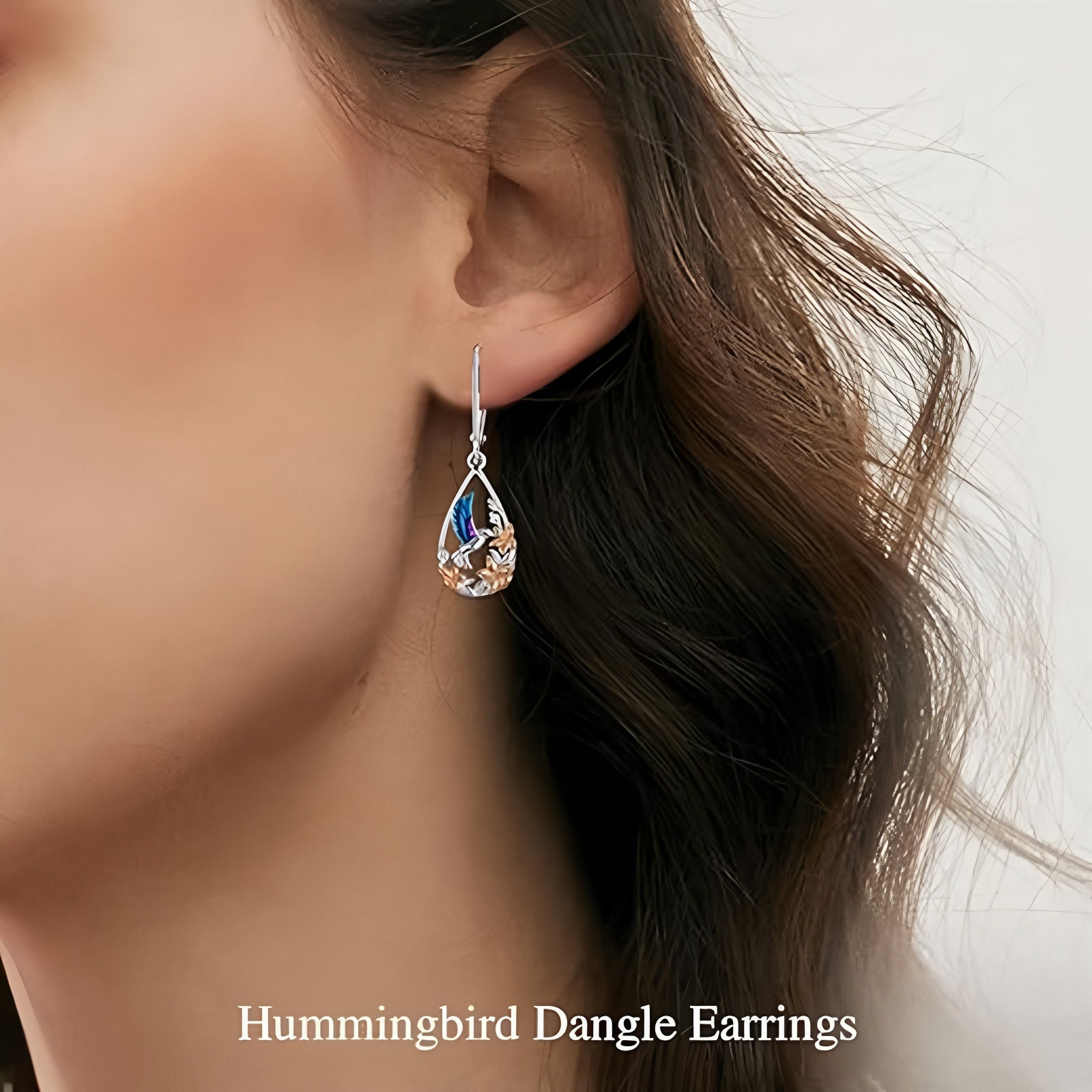 Origsoul handcrafted bird drop earrings with delicate hummingbird design worn on ear