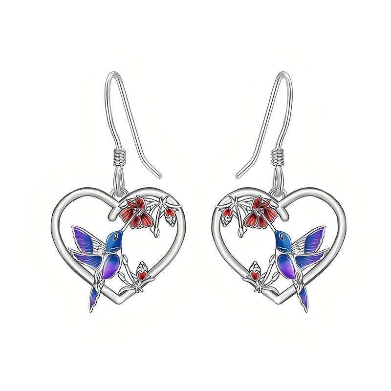 Origsoul hummingbird heart earrings featuring blue and purple hummingbirds with red flowers in heart-shaped silver frames