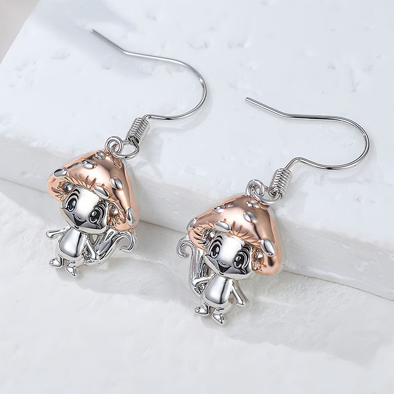 Origsoul whimsical mushroom charm earrings with silver and rose gold tones featuring cute mushroom character design