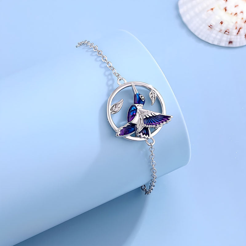 Origsoul 925 silver hummingbird bracelet with blue and purple enamel detailing on a silver chain