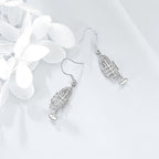 Origsoul 925 silver trumpet earrings with detailed charm design and hook closures on white background