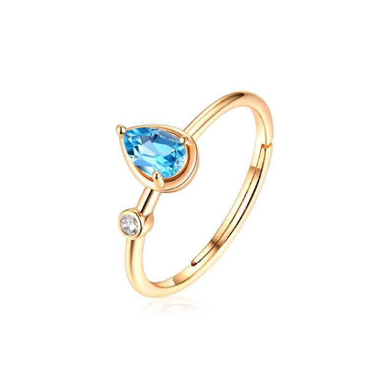 Swiss Blue Topaz Pear Ring in 925 sterling silver, on a hand — Origsoul