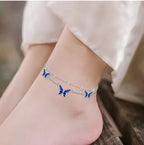 Origsoul adjustable butterfly anklet with blue butterfly charms on silver chains worn on ankle