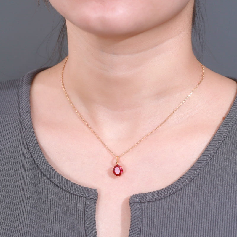 Origsoul delicate gold necklace with red gemstone pendant showcasing affordable luxury jewelry