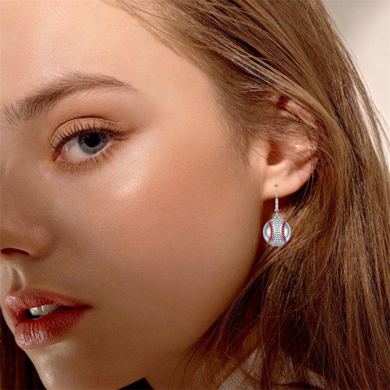 Origsoul baseball dangle earrings for women worn on model with natural makeup and light brown hair