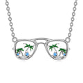 Origsoul silver beach sunglasses necklace with palm trees and blue gem accents on chain