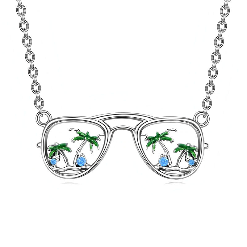 Origsoul silver beach sunglasses necklace with palm trees and blue gem accents on chain