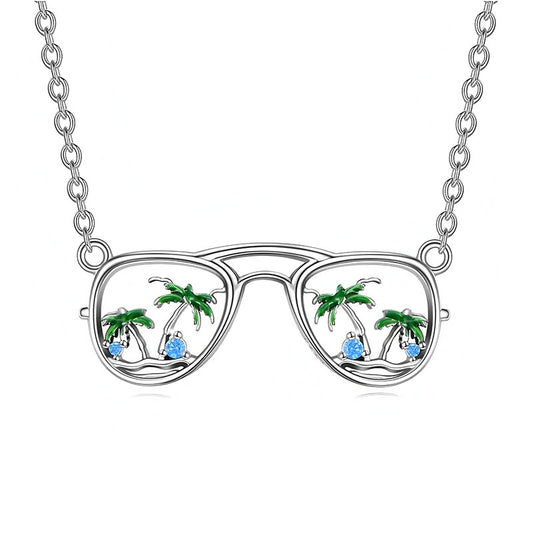 Origsoul silver beach sunglasses necklace with palm trees and blue gem accents on chain