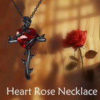 Black rose sterling silver necklace featuring a heart-shaped red gemstone and intricate detailing