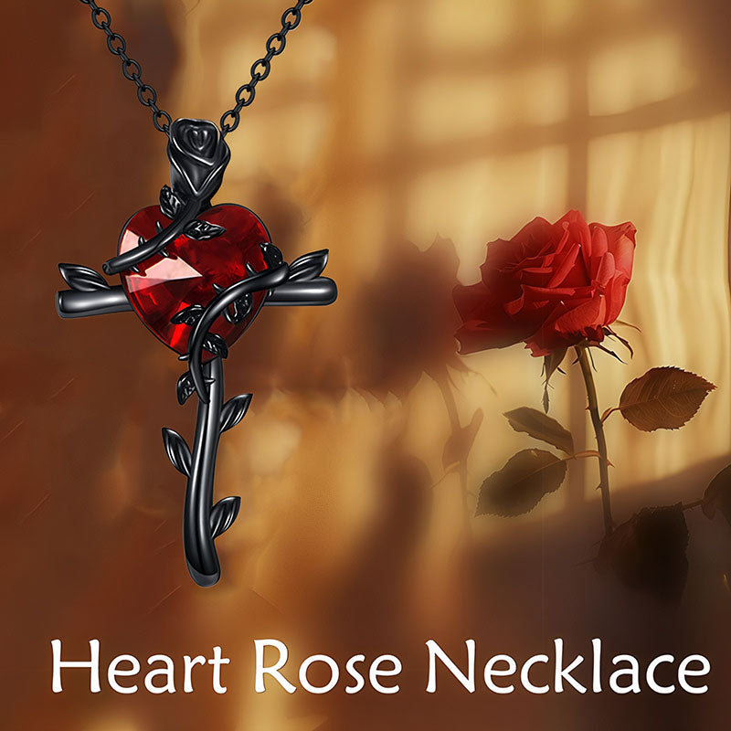 Black rose sterling silver necklace featuring a heart-shaped red gemstone and intricate detailing