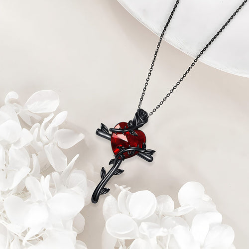 Black rose sterling silver necklace with a red heart gemstone and intricate design