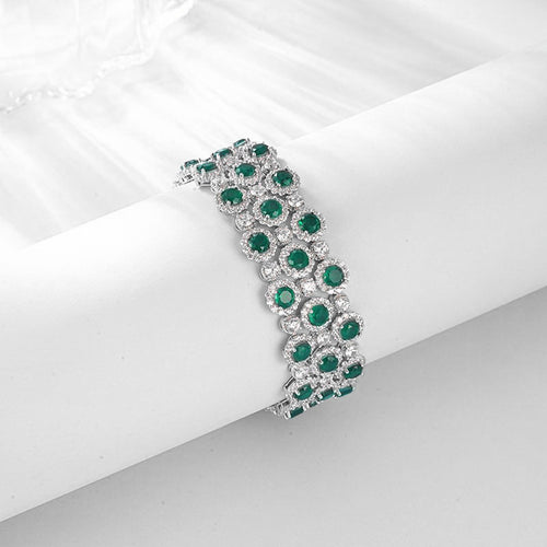 Origsoul bracelet tennis diamond with green emerald gemstones and silver setting on white background