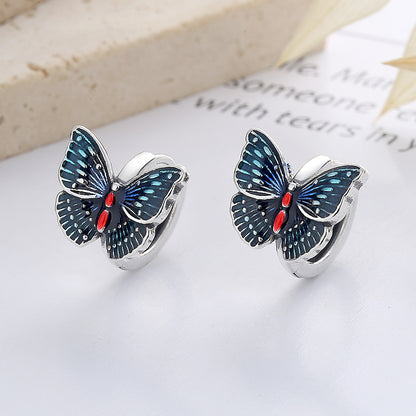 Origsoul butterfly earrings for women with detailed blue and red enamel design on silver hoops