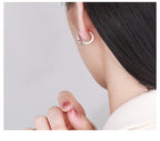 Silver butterfly earrings for women worn on ear showing delicate insect jewelry design by Origsoul
