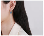Origsoul butterfly tassel earrings with delicate blue and green butterfly and silver chain tassels
