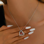 Origsoul cartoon parrot love necklace with heart pendant worn on neck with white nails