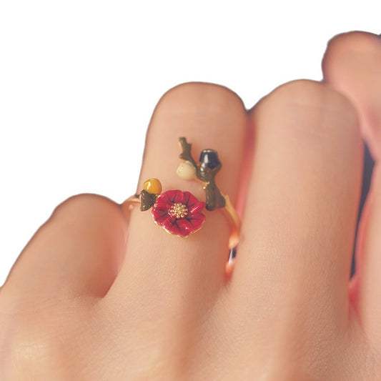 Origsoul February birth flower ring featuring a delicate red flower on a gold band