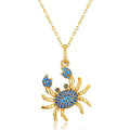 Origsoul gold crab pendant with blue stones on a silver necklace sterling chain