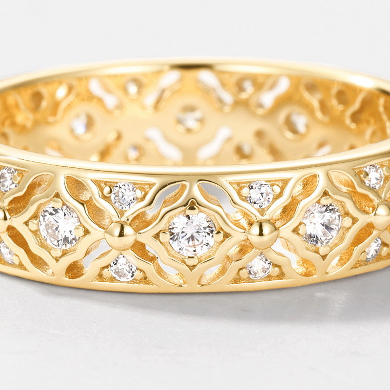 Origsoul gold ring of engagement with intricate floral design and embedded sparkling diamonds