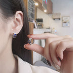Origsoul daisy hoop earrings for women featuring blue and white flower design on silver hoops