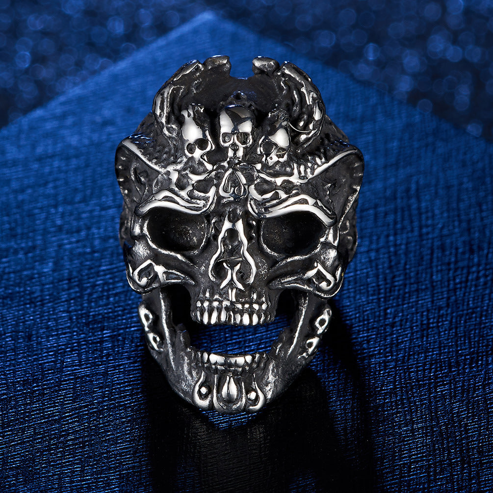 Origsoul silver death head biker ring with detailed skull design on textured dark blue background