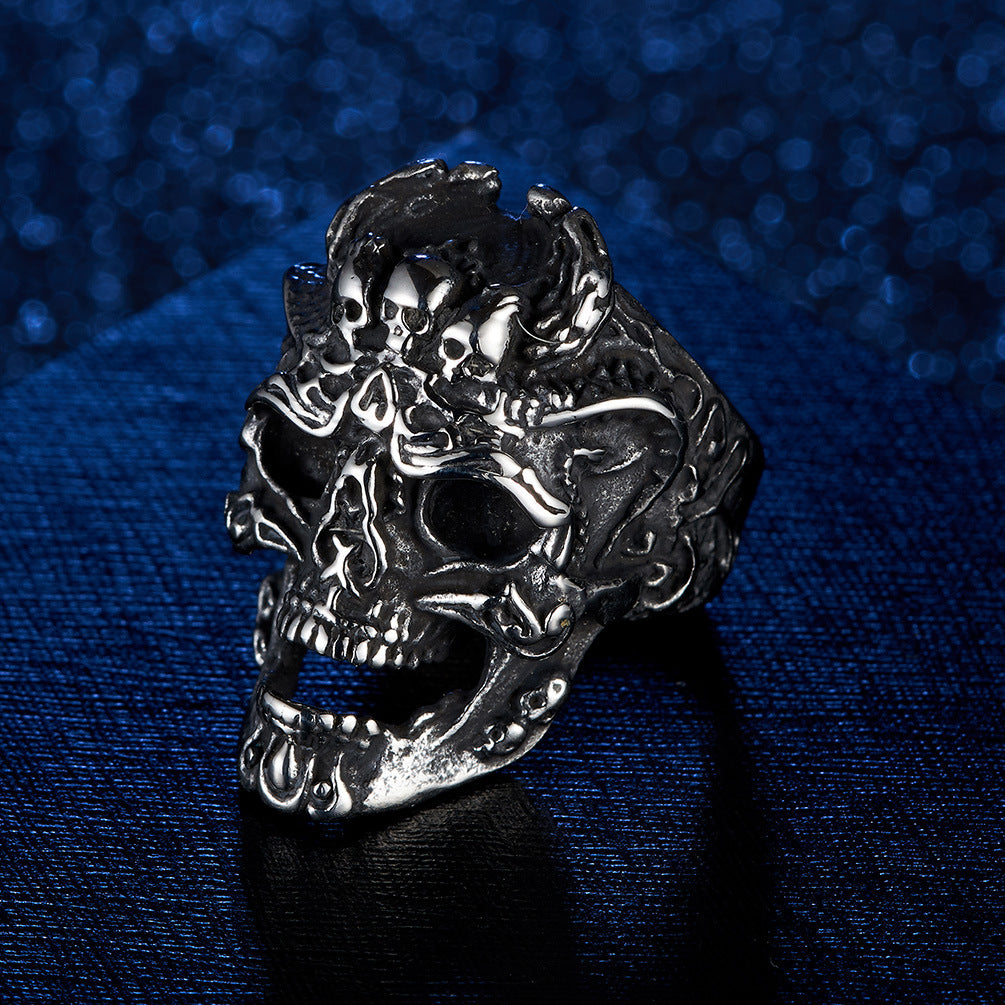 Origsoul death head biker ring in silver metal with detailed skull design on dark blue background