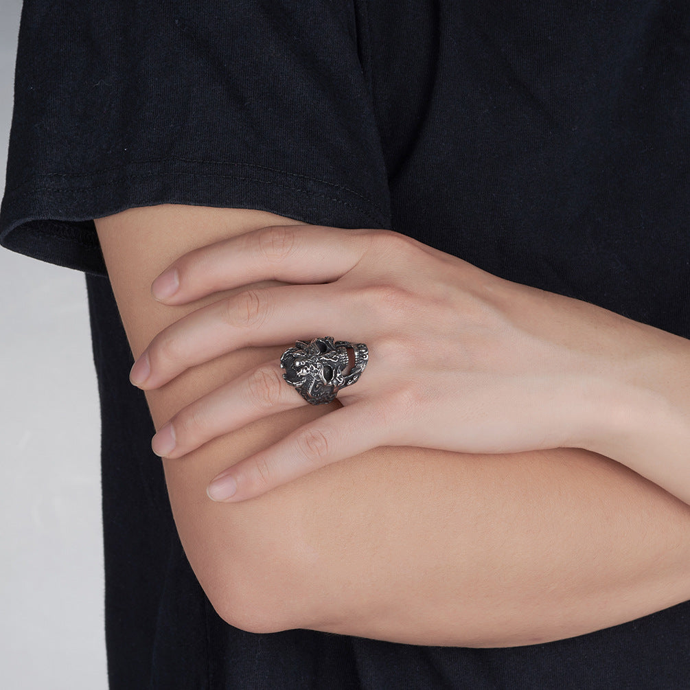 Origsoul death head biker ring worn on hand with crossed arms in black shirt