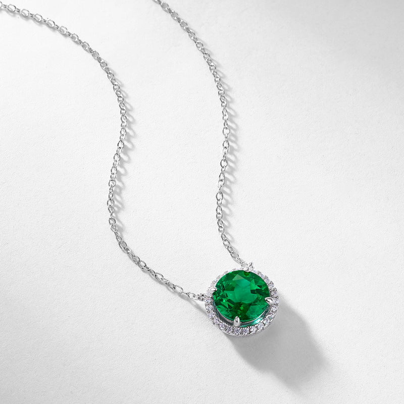 Origsoul silver necklace and choker with a round green gemstone pendant surrounded by small crystals