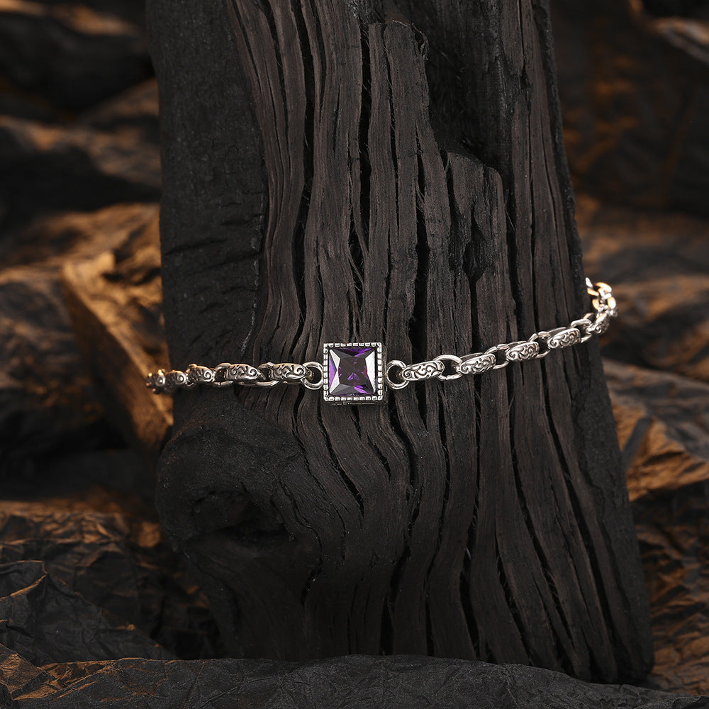 Origsoul designer embossed chain bracelet with a square purple gemstone centerpiece on textured silver links