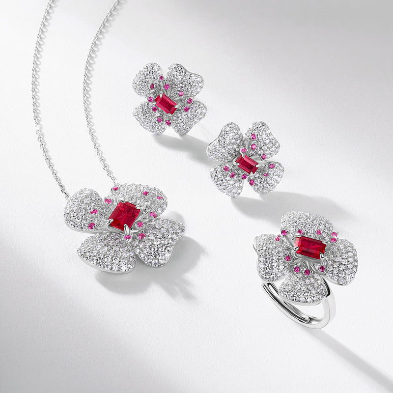Origsoul earrings diamond stud earrings with floral design and red gemstone center on silver chain