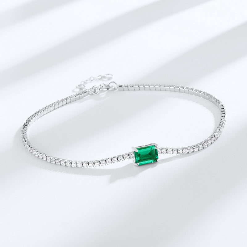 Origsoul delicate bracelet with emerald centerpiece and silver chain featuring sparkling accents