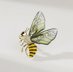 Elegant nature-inspired brooch in the shape of a bee with colorful wings and sparkling details