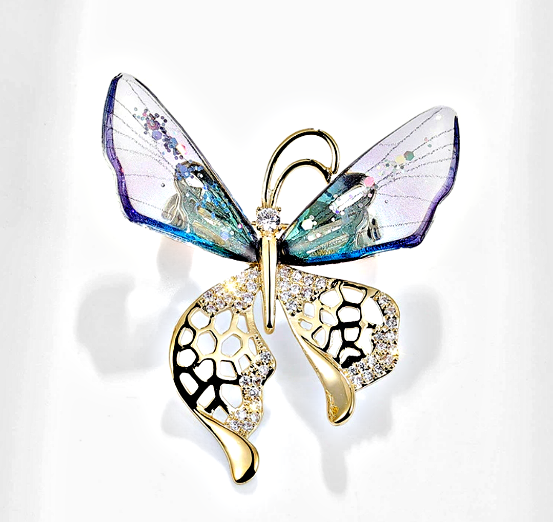 Elegant nature-inspired brooch featuring a butterfly design with colorful details and sparkling embellishments