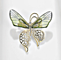 Elegant nature-inspired brooch featuring a butterfly design with green accents and sparkling details