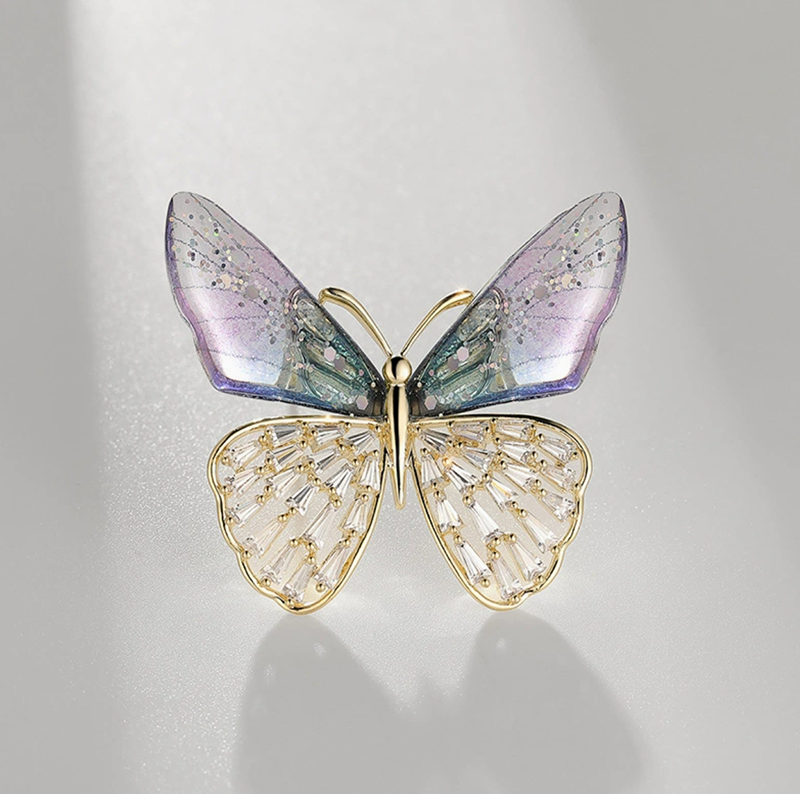 Elegant nature-inspired brooch featuring a colorful butterfly design with intricate details