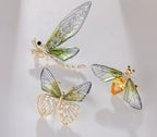 Set of insect jewelry featuring elegant nature-inspired brooch designs with colorful details and gold accents