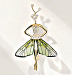 Elegant nature-inspired brooch featuring a stylish figure adorned with butterfly wings and crystal accents